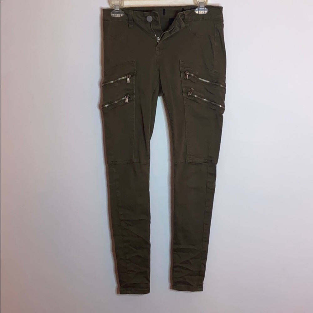 Army green skinny jeans with zippers